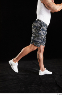 Grigory  1 camo shorts dressed flexing leg side view…